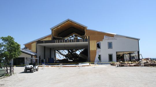 Volunteers help clear debris at Covered Bridge Venue