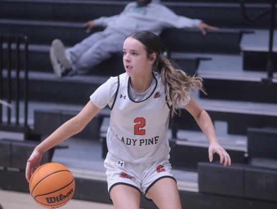 Lady Pines battle through holidays, down Lake Worth in district play