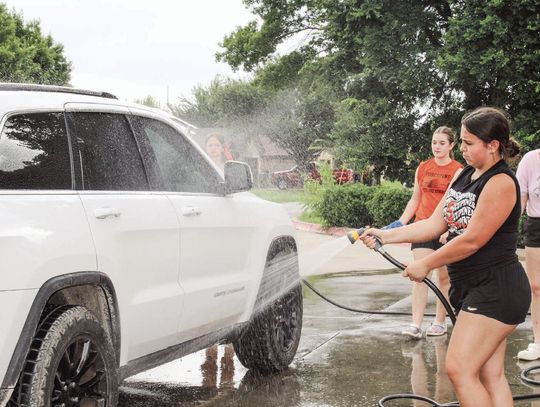Showstoppers wash cars at AutoZone