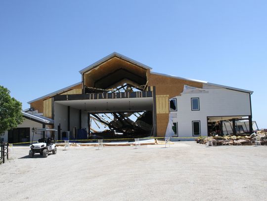 Volunteers help clear debris at Covered Bridge Venue