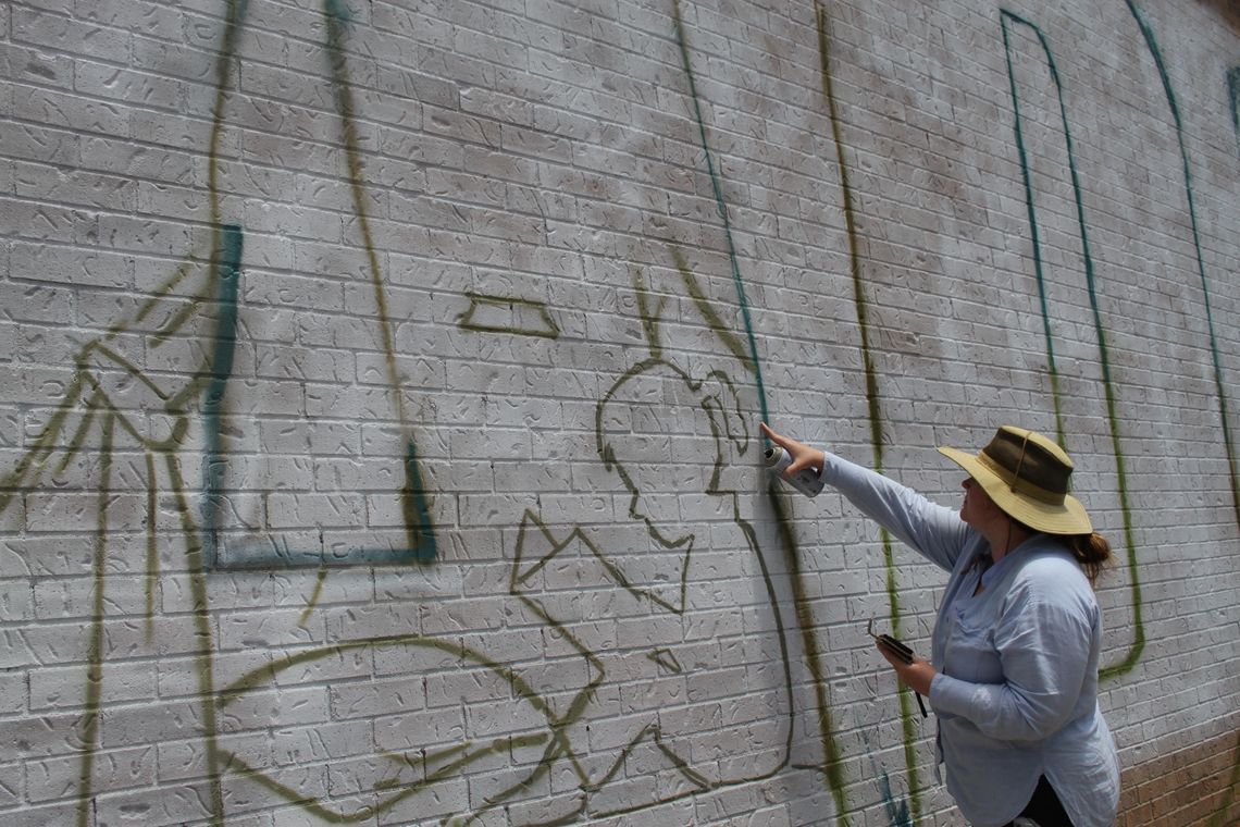 Artist brings collaborative vision to library mural Artist brings collaborative vision to library mural