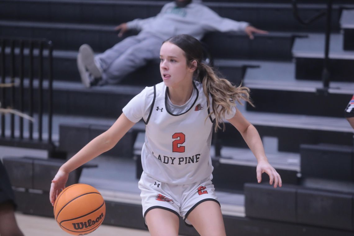 Lady Pines battle through holidays, down Lake Worth in district play