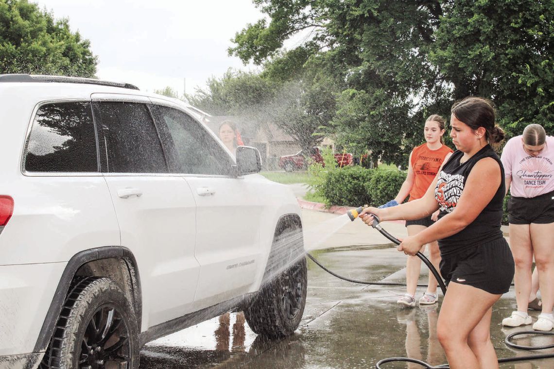 Showstoppers wash cars at AutoZone