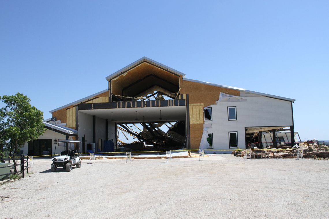 Volunteers help clear debris at Covered Bridge Venue